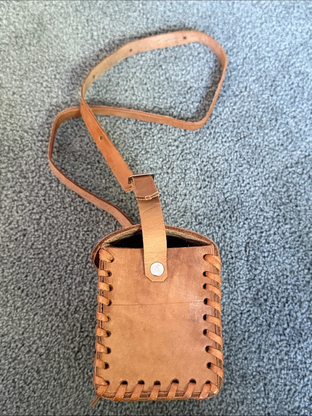 Vintage Tooled Leather Crossbody Bag with Buckle Front.